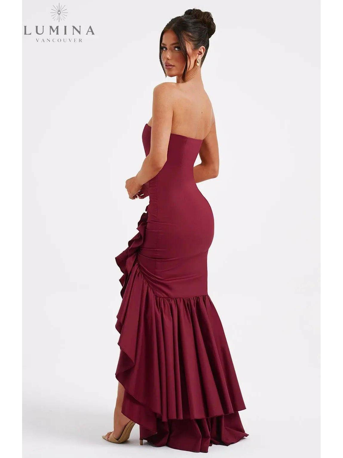 Blue floral Riviera sleeveless slit ruffle maxi dress by Lumina Wear, perfect for wedding guests, shown on a model.