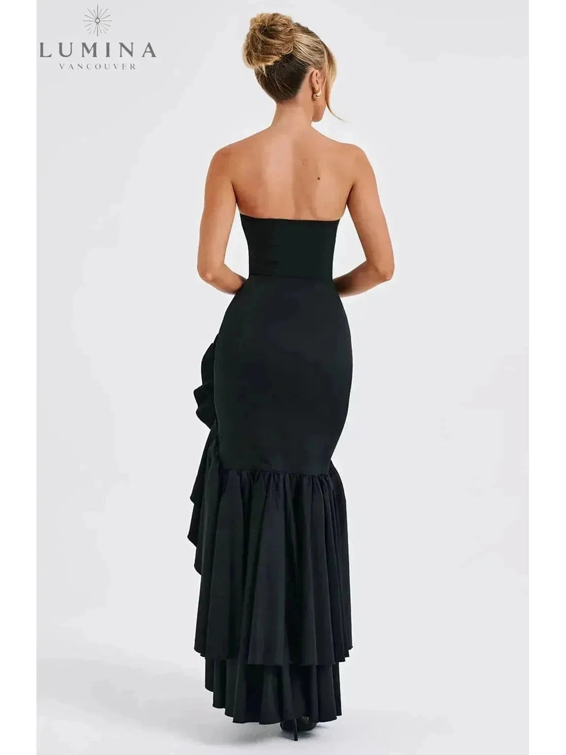 Blue floral sleeveless slit ruffle maxi dress by Lumina Wear, perfect for wedding guests, featuring a flowing silhouette.