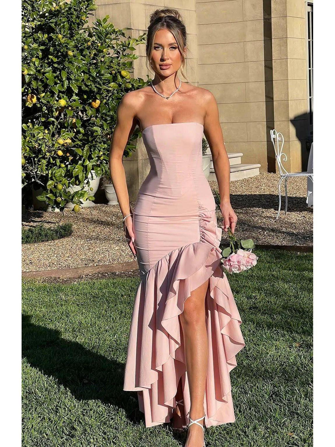 Blue floral Riviera sleeveless slit ruffle maxi dress by Lumina Wear, perfect as a wedding guest dress, shown on a model.