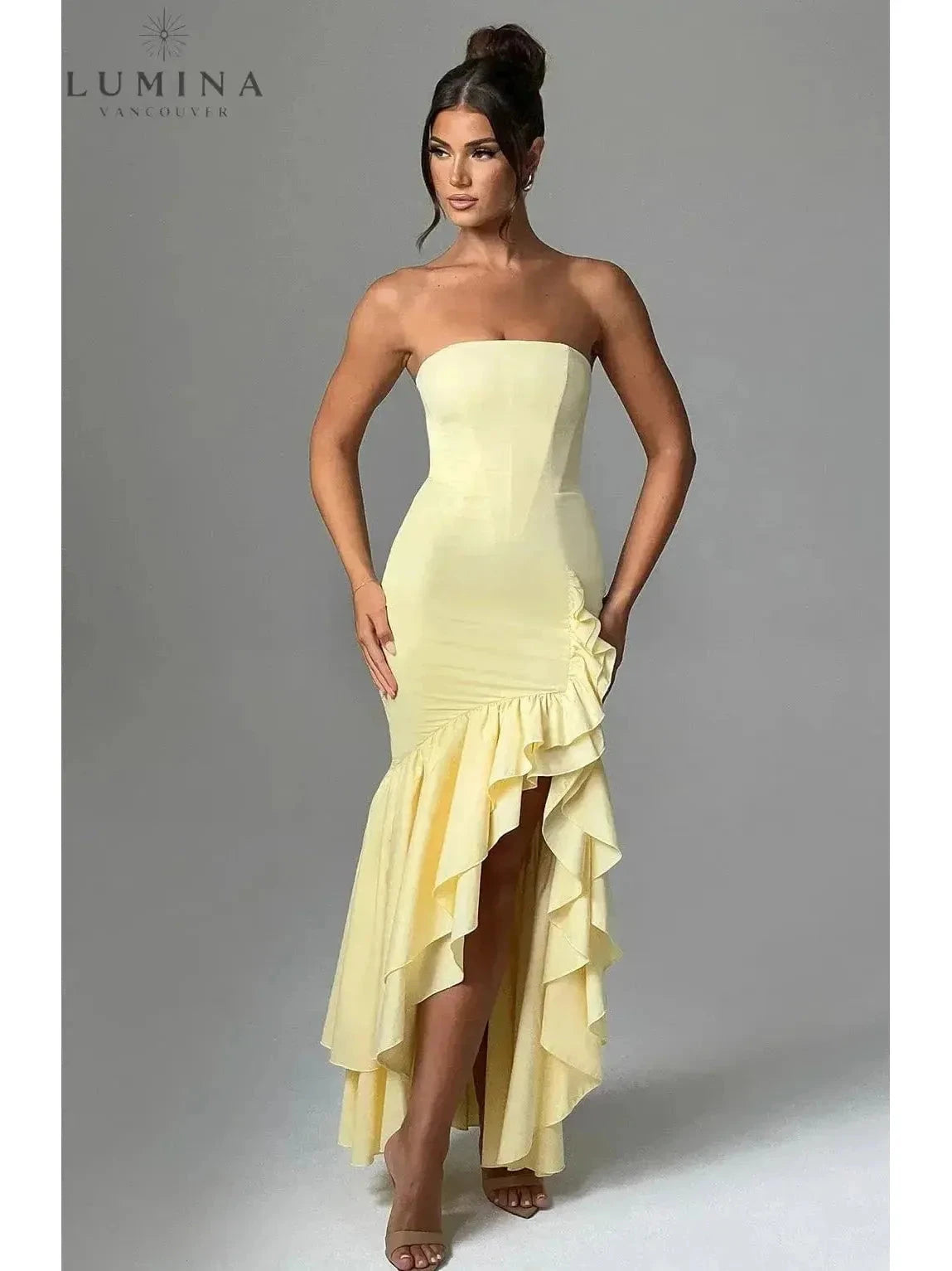 Blue floral sleeveless slit ruffle maxi dress by Lumina Wear, perfect for wedding guests, featuring a flowy silhouette and elegant design.