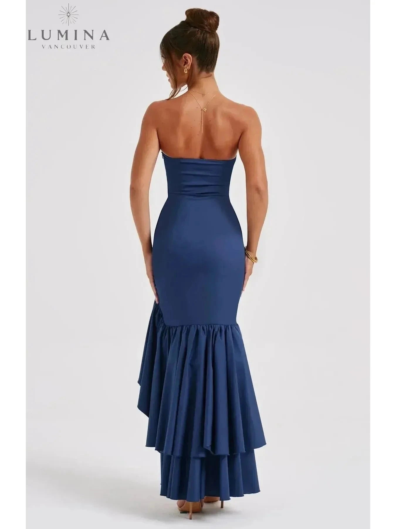 Blue floral sleeveless maxi dress with slit and ruffle details by Lumina Wear, perfect for wedding guests.