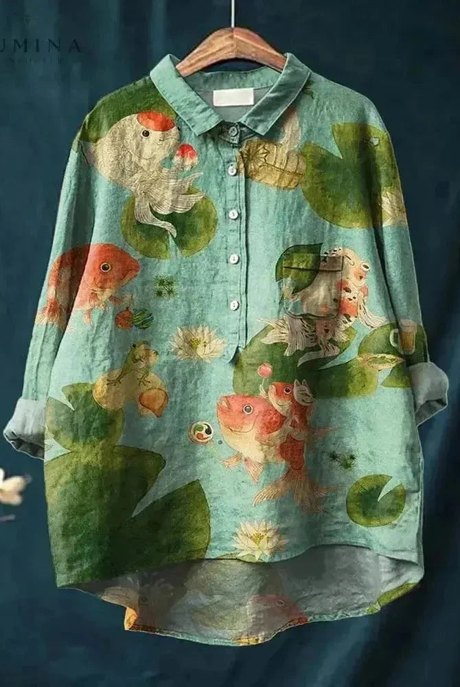 Green Rosa Fish Print T-Shirt by Lumina Wear featuring a vibrant fish design on a casual T-shirt.
