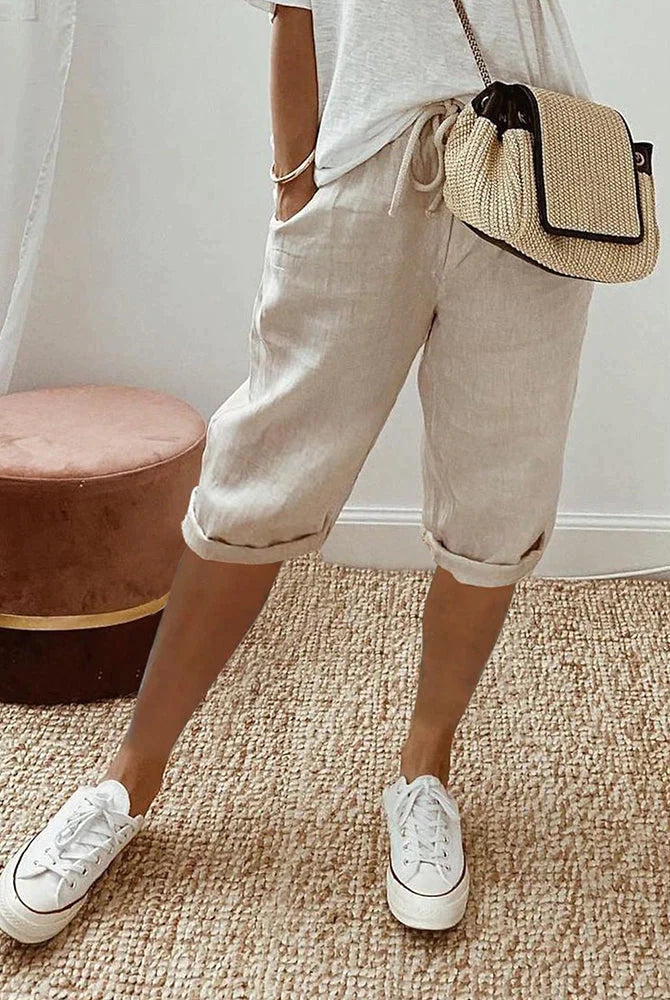 Rosa beige linen blend shorts with adjustable waist from Lumina Wear, relaxed fit, featuring a casual style and green accents.