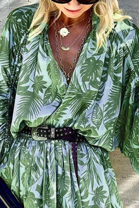 Green Theotiste Serenity V-Neck Wrap Mini Dress by Lumina Wear, featuring a flattering wrap design and short length.