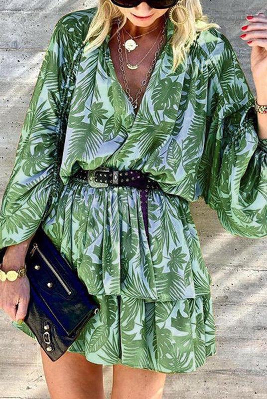 Green Theotiste Serenity V-neck wrap mini dress by Lumina Wear, featuring a stylish silhouette and elegant design.