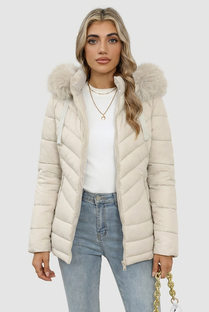 Black Lumina Wear Ruby cozy quilted puffer jacket with faux-fur hood, designed for women, featuring a stylish and warm winter coat.