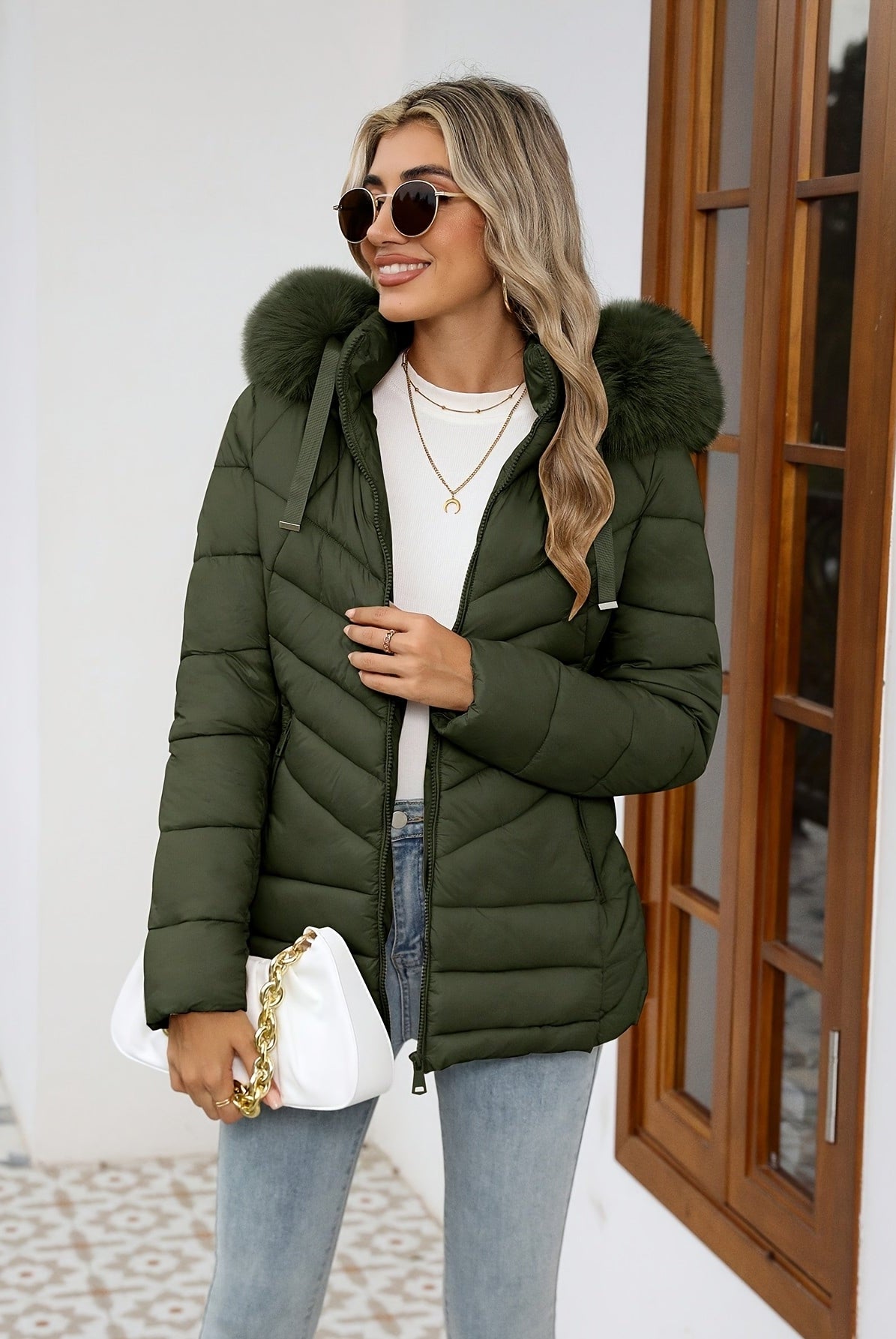 Black Ruby cozy quilted puffer jacket with faux-fur hood from Lumina Wear, designed for women, featuring a warm, padded style.