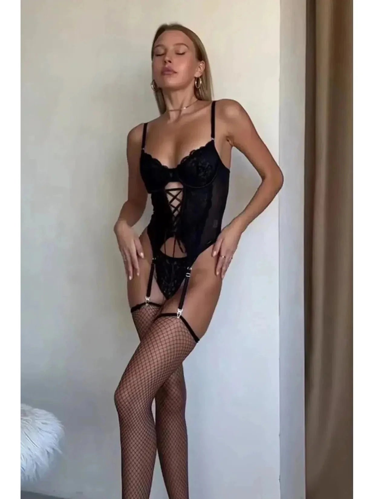 Lumina Vancouver Gaelle Secret Bodysuit lingerie, black sheer fabric with delicate lace details and adjustable straps.