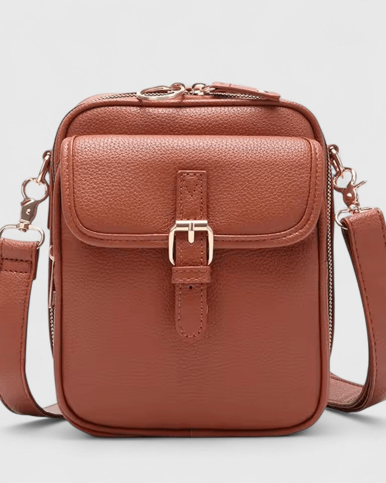 Lumina Wear Seraphina elegant compact crossbody handbag with adjustable strap, shown in brown leather.