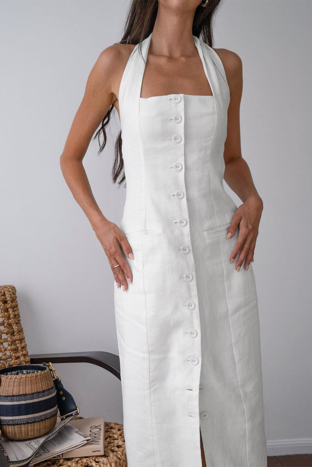 White Suvi halter neck maxi dress by Lumina Wear, featuring a flowing silhouette and elegant design, perfect for summer wear.