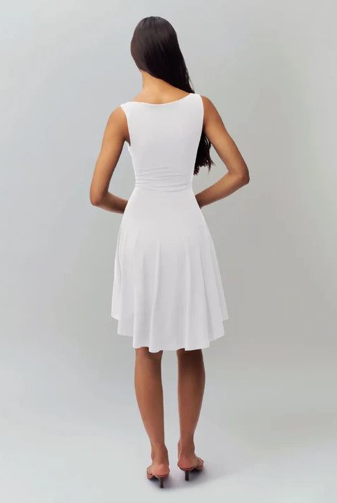 White satin finish mini dress by Lumina Wear, featuring a sleek fit and elegant design, modeled on Seraphina.