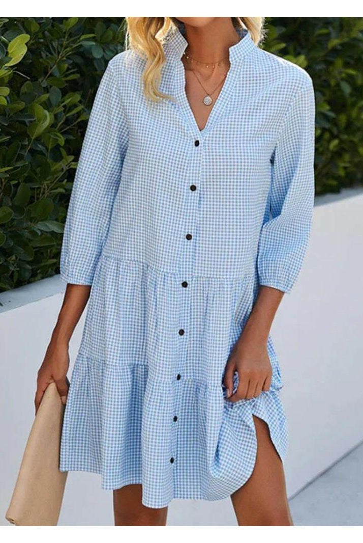 Lumina Wear Serelle Breeze buttoned dress, lightweight and stylish, displayed on a hanger with a casual outdoor background.