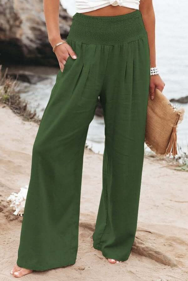 Serena white wide-leg trousers with elastic waist by Lumina Wear, breathable fabric, relaxed fit, stylish and comfortable.