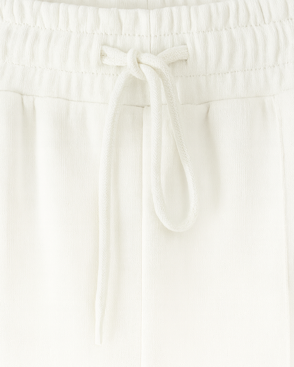 Serena white lounge set by Lumina Wear featuring casual chic style with modern zipper details, perfect for comfortable loungewear.
