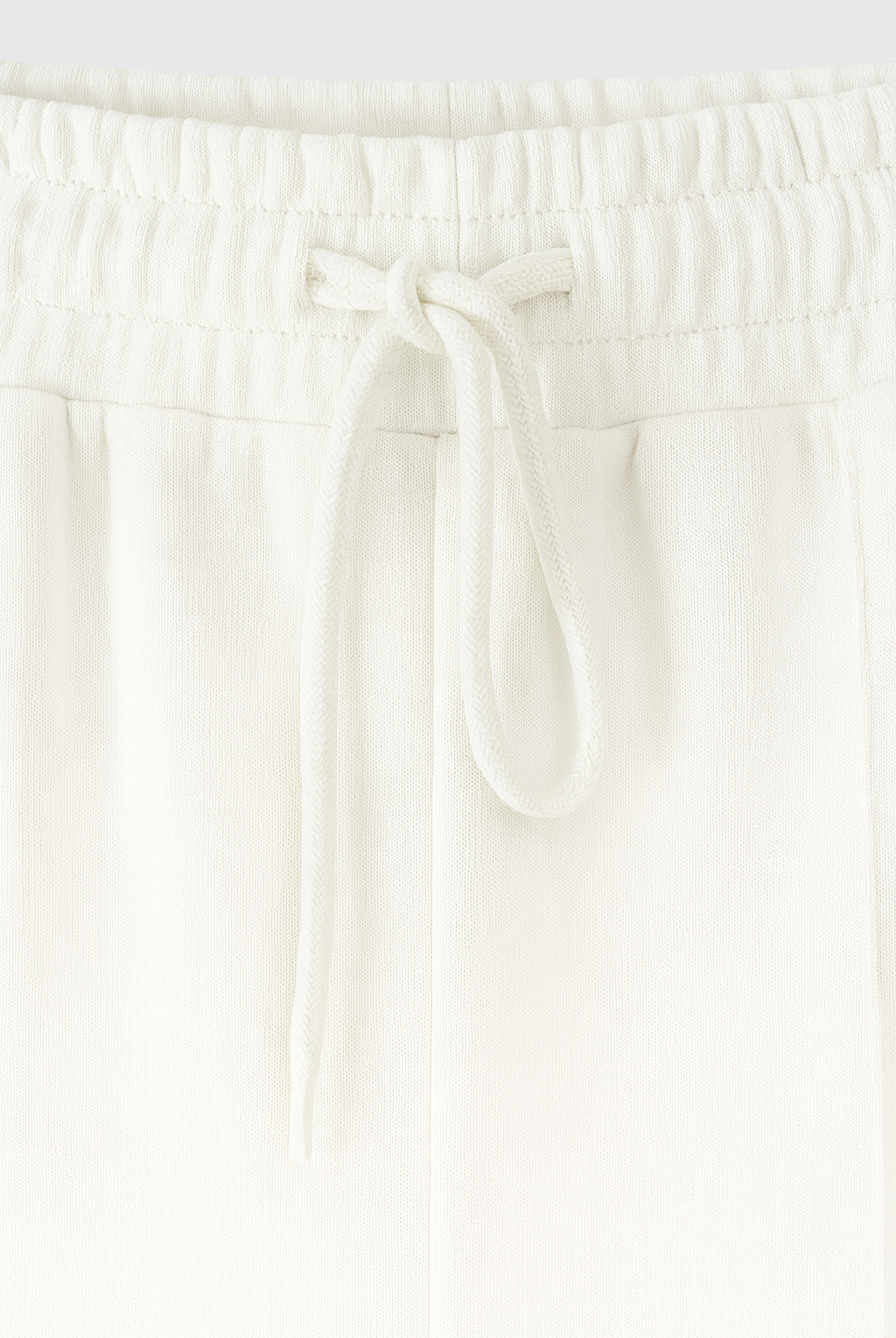 Serena white lounge set by Lumina Wear featuring casual chic style with modern zipper details, perfect for comfortable loungewear.