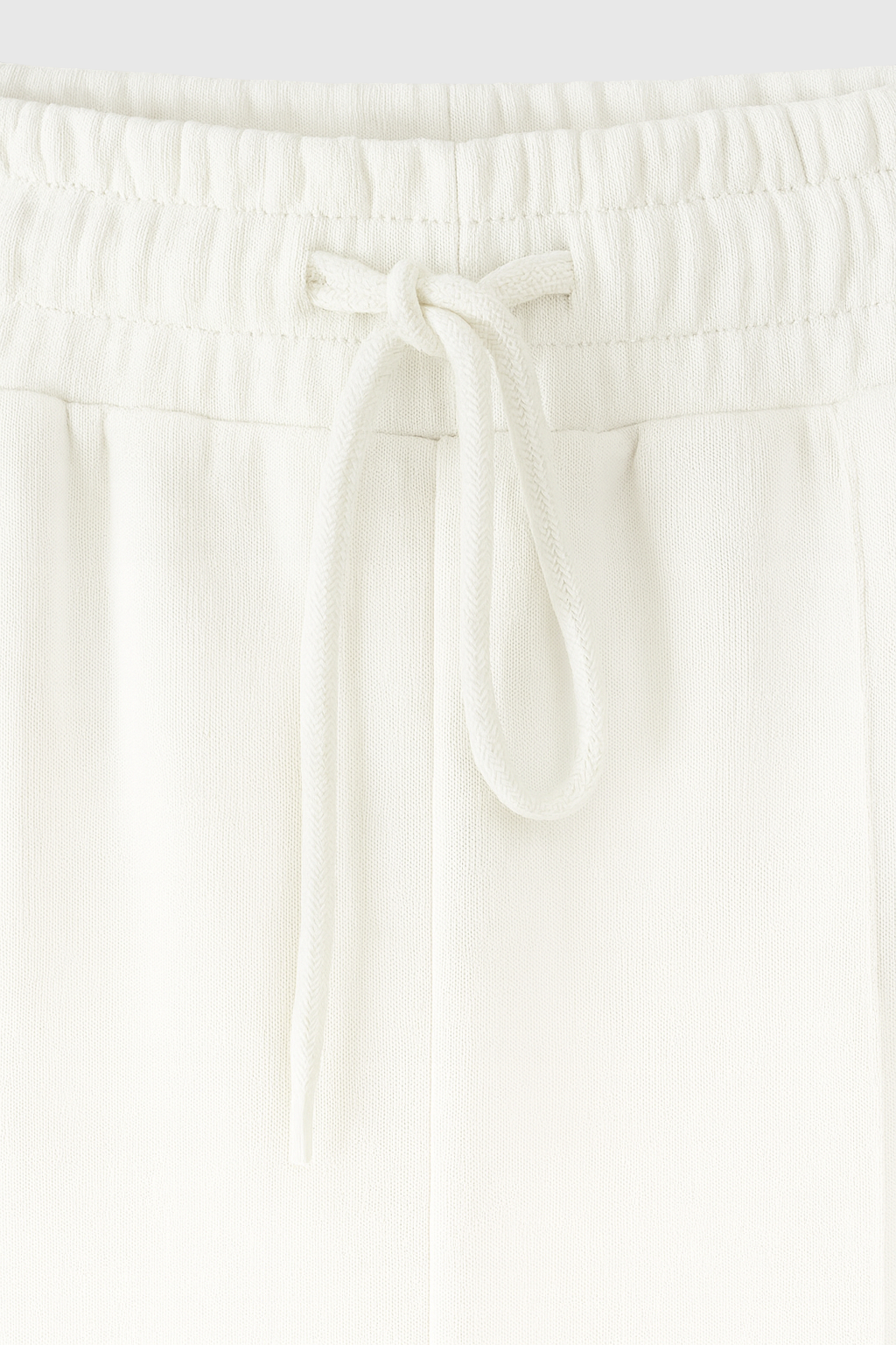 Serena white lounge set by Lumina Wear featuring casual chic style with modern zipper details, perfect for comfortable loungewear.