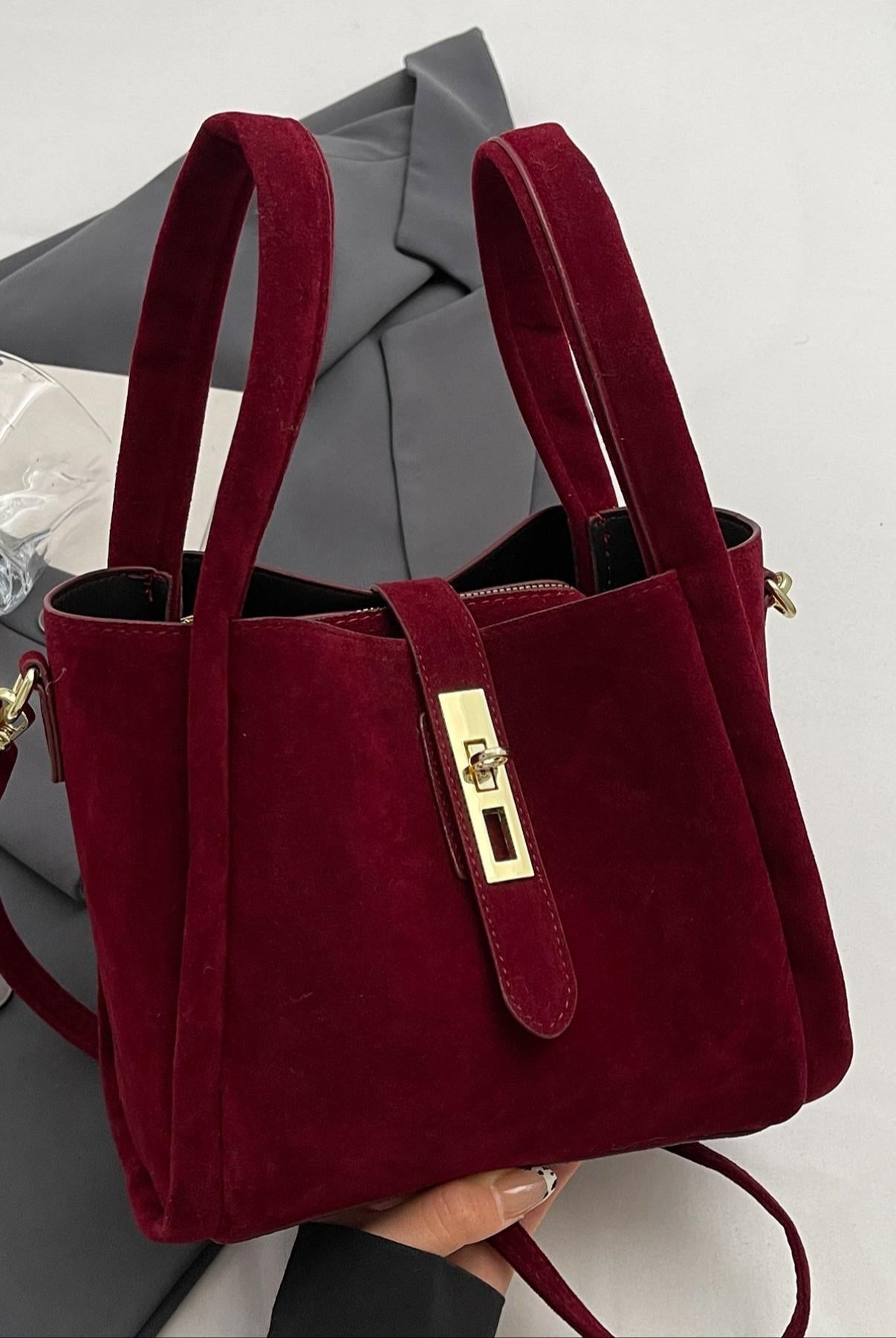 Coffee brown Serena Lumina crossbody handbag with retro design, versatile style, and structured shape in a fashionable handbag image.