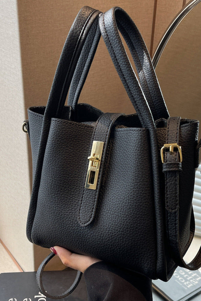 Coffee brown Lumina Serena chic retro crossbody handbag with versatile design, featuring structured shape and adjustable strap.