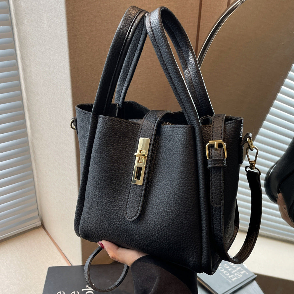 Coffee brown Lumina Serena chic retro crossbody handbag with versatile design, featuring structured shape and adjustable strap.