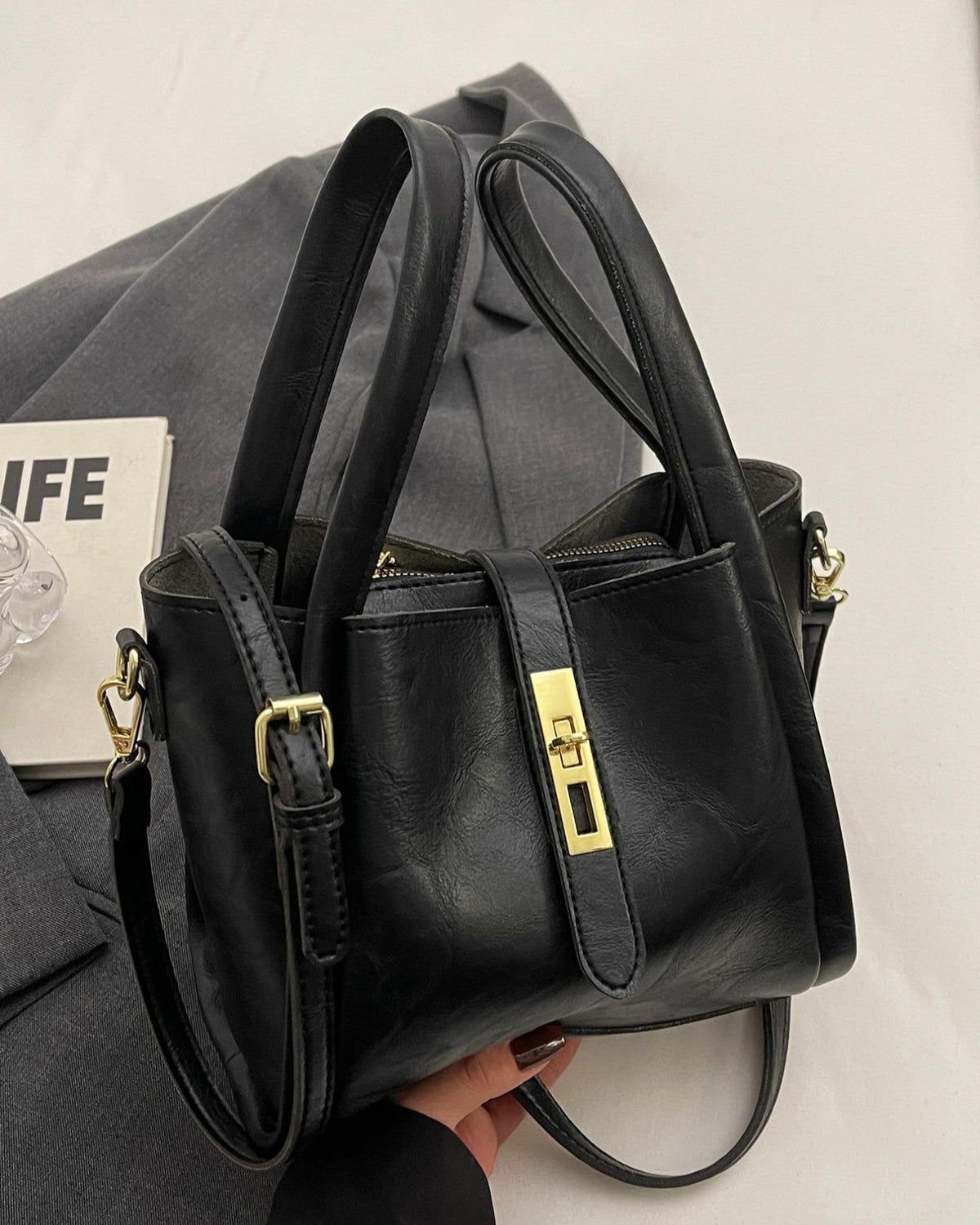 Coffee brown Serena Lumina Wear chic retro crossbody handbag with versatile design, featuring structured silhouette and stylish details.
