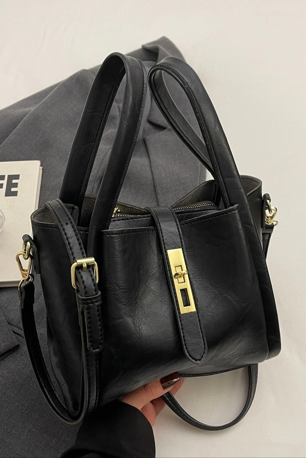 Coffee brown Serena Lumina Wear chic retro crossbody handbag with versatile design and stylish details.