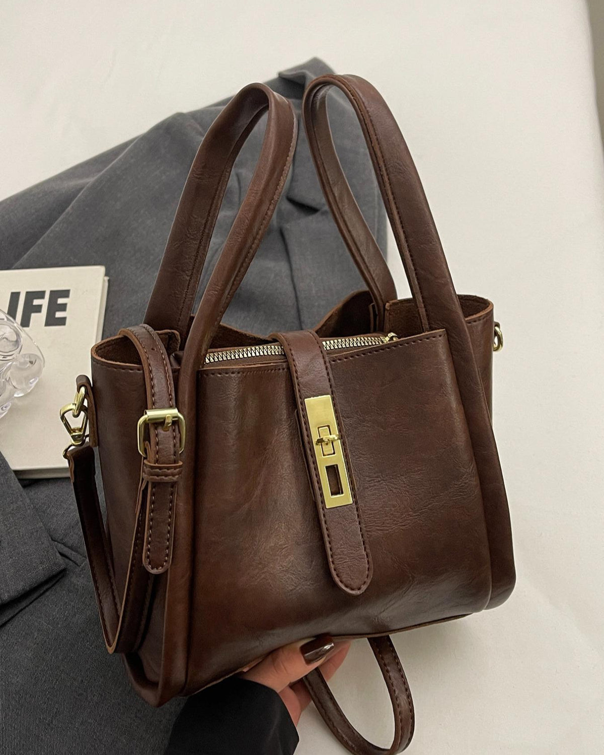 Lumina Wear Serena chic retro crossbody handbag in coffee brown with versatile design and stylish details.