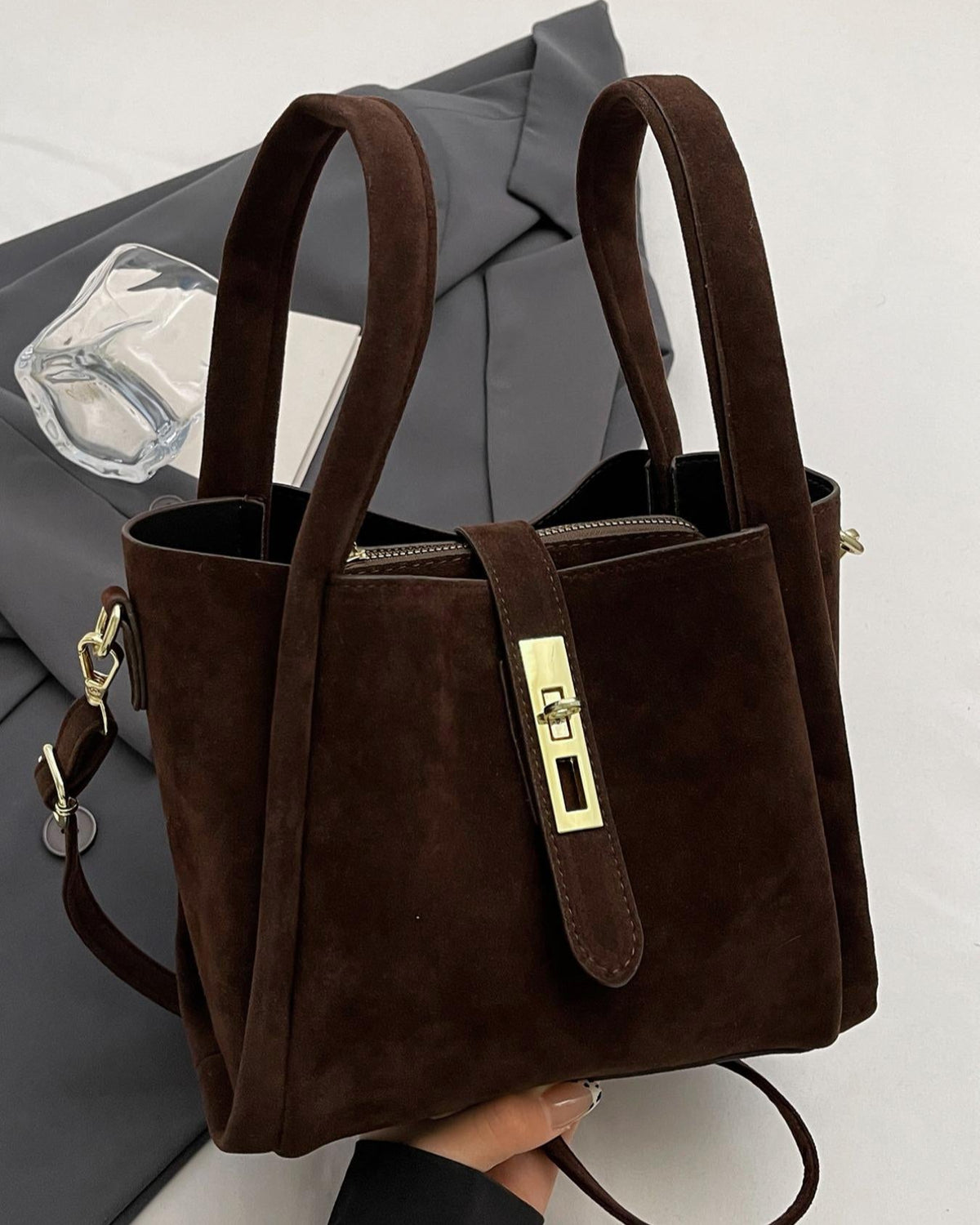 Coffee brown Serena Lumina crossbody handbag with chic retro design and versatile style, featuring a compact, stylish silhouette.