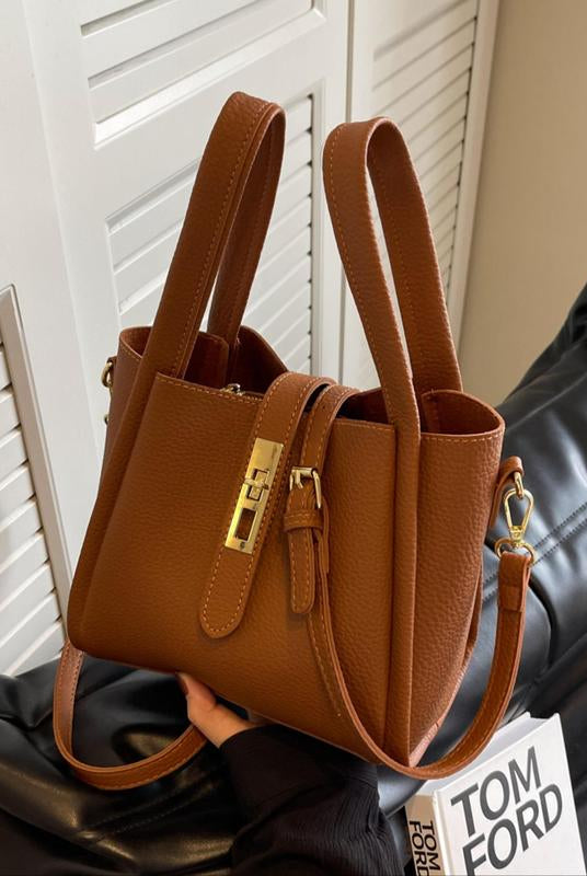 Coffee brown Serena Lumina crossbody handbag with a chic retro design, versatile style, and adjustable strap.