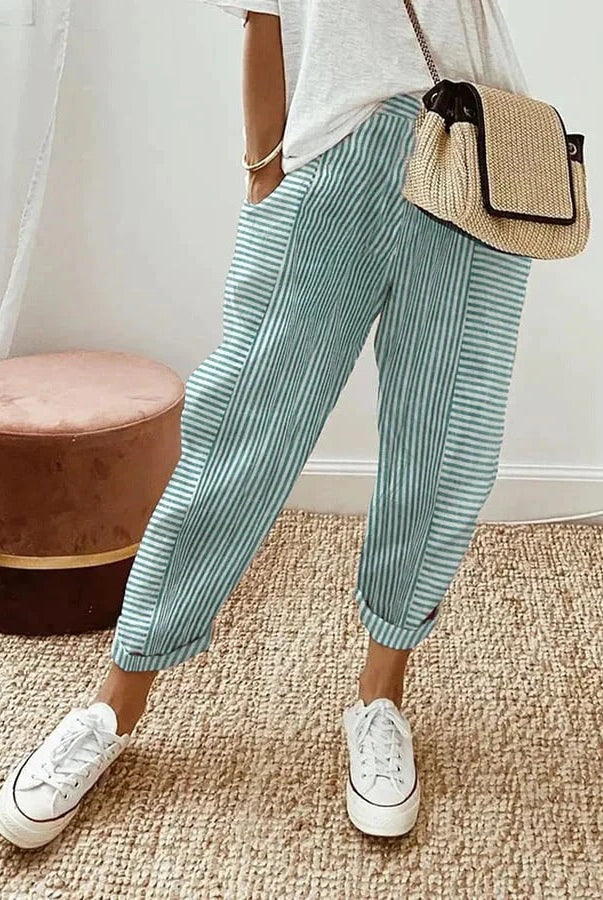 Blue Serena Lumina Wear striped high waist trousers with pockets, showcasing a stylish, tailored fit and modern design.