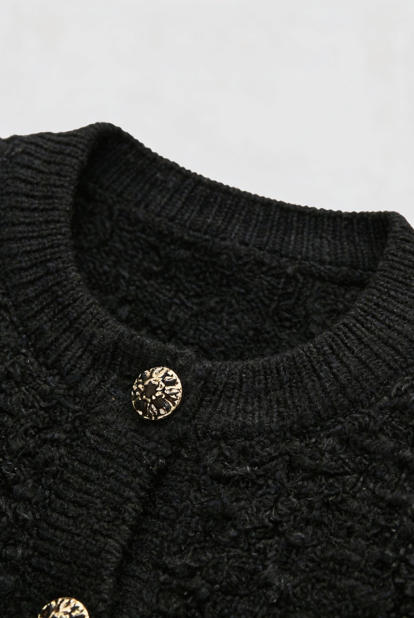 Black knit cardigan with open front by Lumina Wear, styled for women, featuring a cozy and relaxed fit.