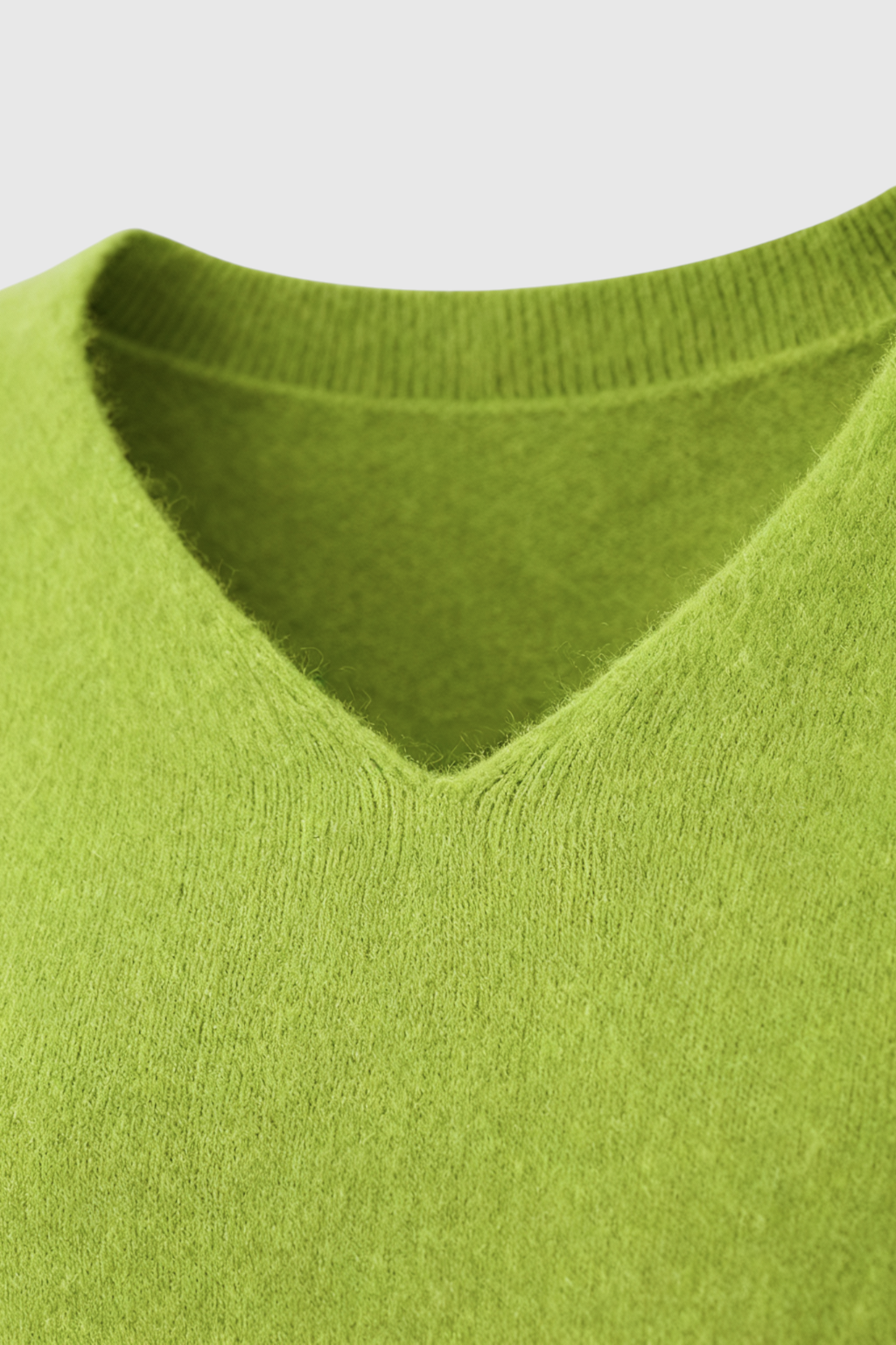 Light green Lumina Wear Serena V-neck women's sweater with a cozy fit, featuring a flattering silhouette and soft knit texture.
