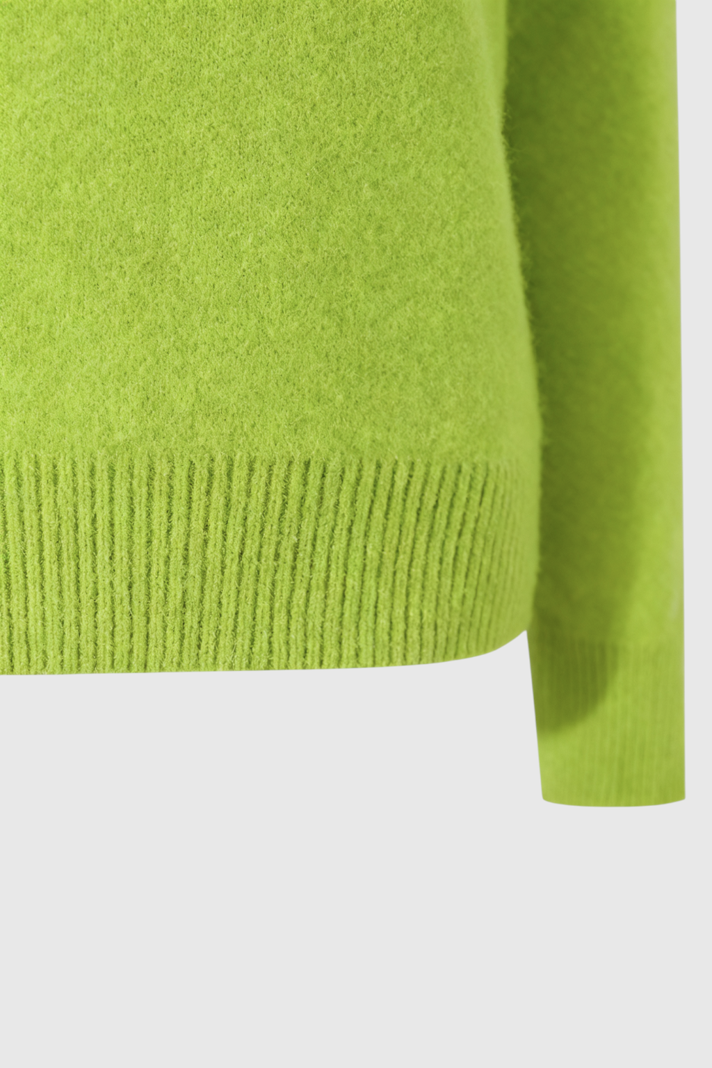 Light green Lumina Wear Serena women's V-neck sweater with a cozy, flattering fit, displayed on a plain background.