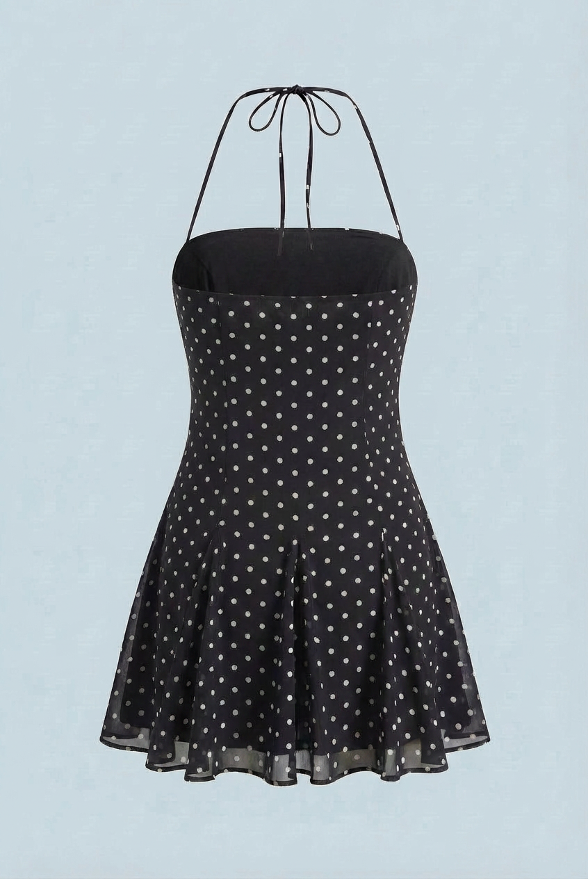 Serena black flared mini dress with polka dot print by Lumina Wear, stylish dress with a fitted waist and playful pattern.
