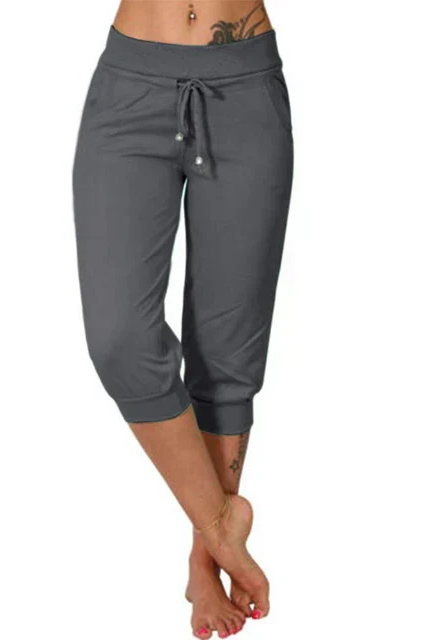 Trendy grey Capri trousers with elastic waistband from Lumina Wear, casual fit, shown on a model.