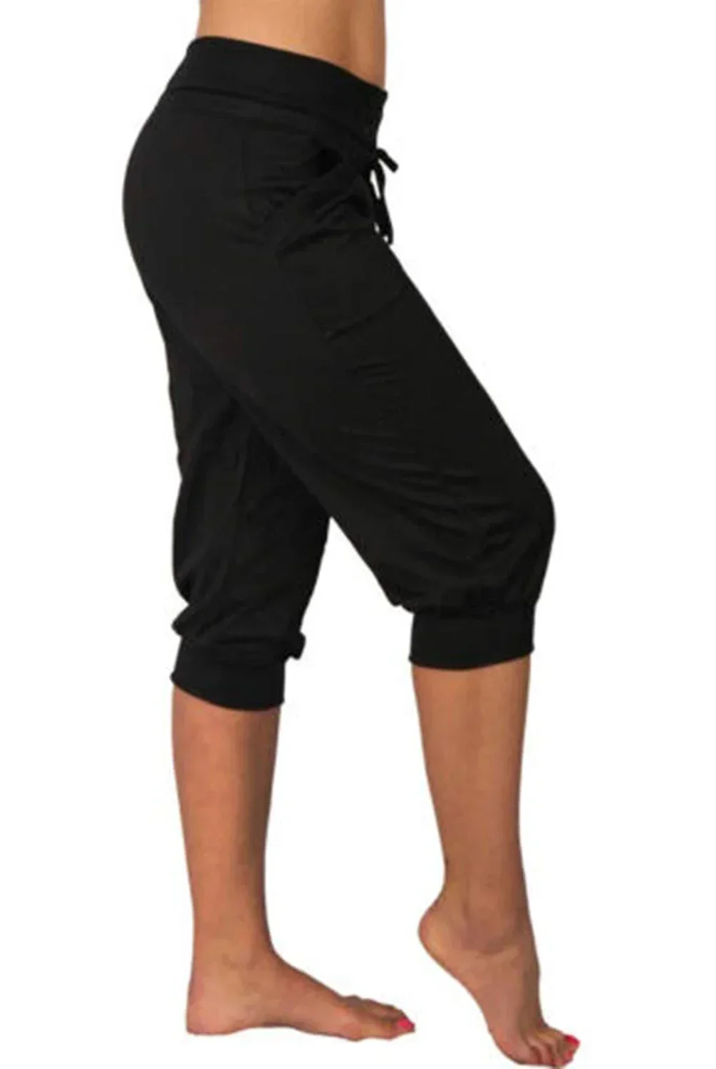 Trendy grey Capri trousers with elastic waistband by Lumina Wear, shown on a model with beige background.