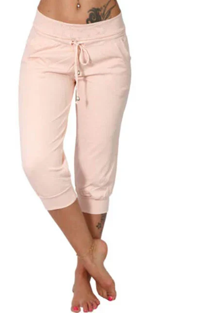 Trendy grey Capri trousers with elastic waistband by Lumina Wear, shown on a model, casual and comfortable fit.