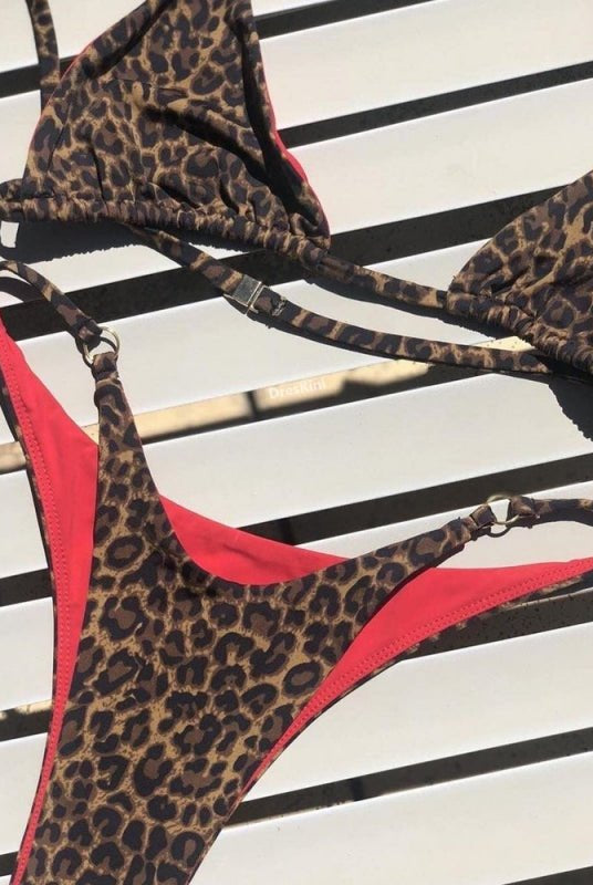 Red animal print bikini set from Lumina Vancouver featuring a stylish bikini top and bottom for summer beachwear.