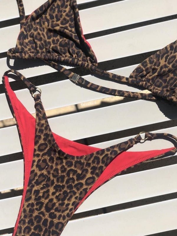 Red animal print bikini set from Lumina Vancouver featuring a stylish bikini top and bottom for summer beachwear.