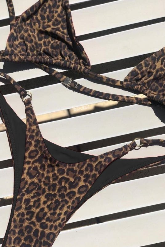 Red animal print bikini set from Lumina Vancouver with a stylish, sexy design, perfect for summer beachwear.