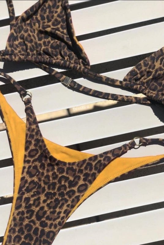 Red animal print bikini set by Lumina Vancouver, featuring a stylish two-piece swimwear design with a sexy, fitted look.