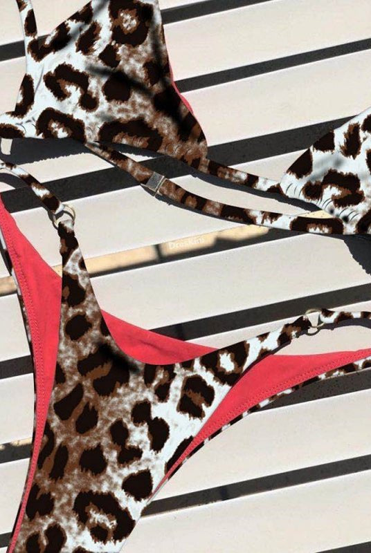 Red animal print bikini set from Lumina Vancouver featuring a stylish, sexy design perfect for summer beachwear.