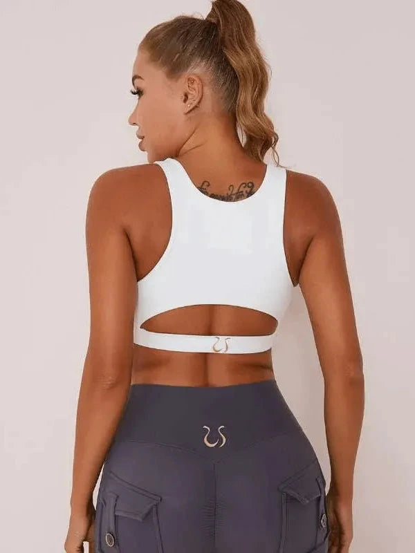 White Lumina Vancouver sexy cutout sports bra with stylish design and supportive fit, ideal for active wear and workouts.