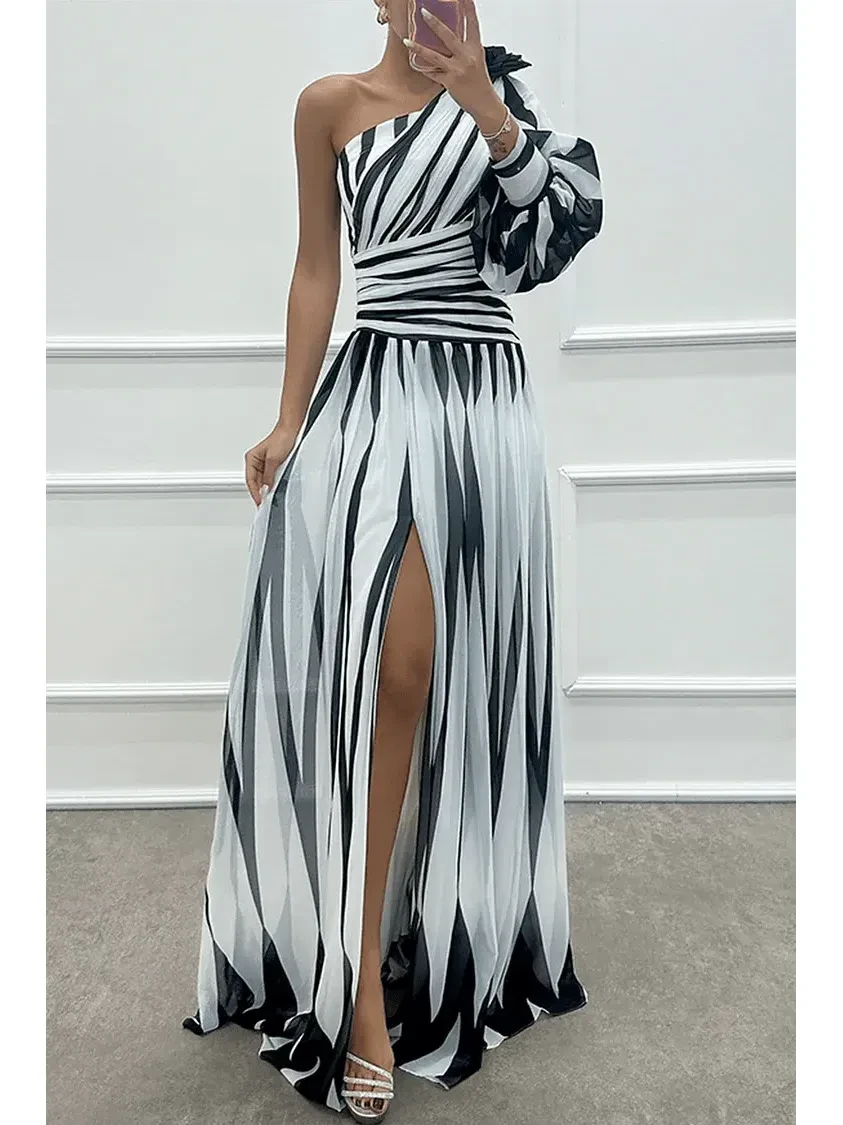 Elegant white striped one-shoulder maxi dress by Lumina Vancouver, featuring a flowing silhouette and stylish design.