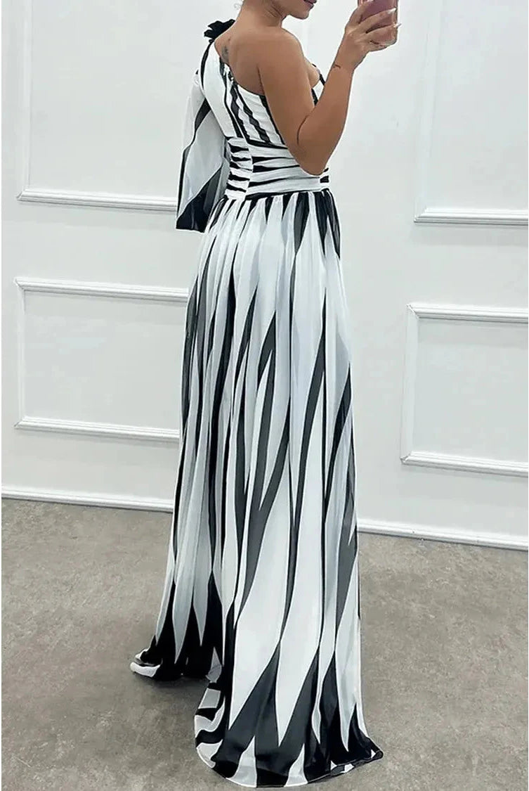 Lumina Wear Shiloh elegant striped one-shoulder maxi dress in white, flowing fabric with stylish design and asymmetric shoulder.