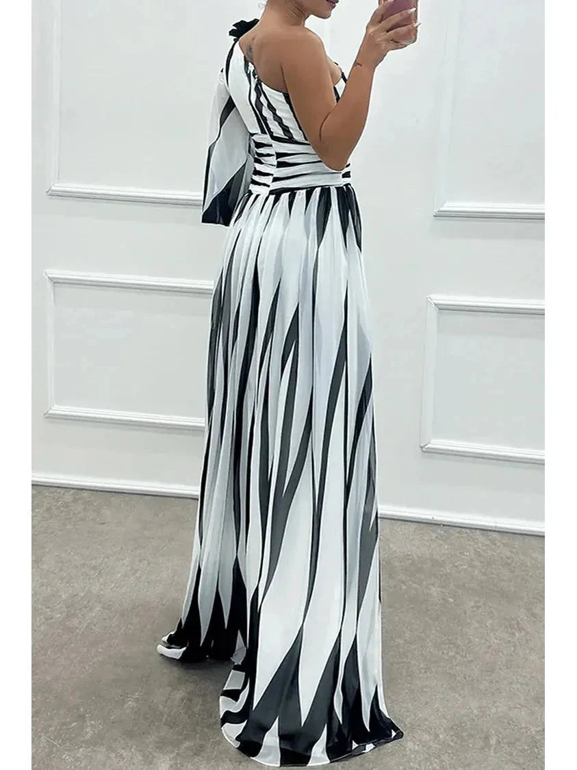 Elegant white striped one-shoulder maxi dress from Lumina Vancouver, featuring a flowing silhouette and stylish design.