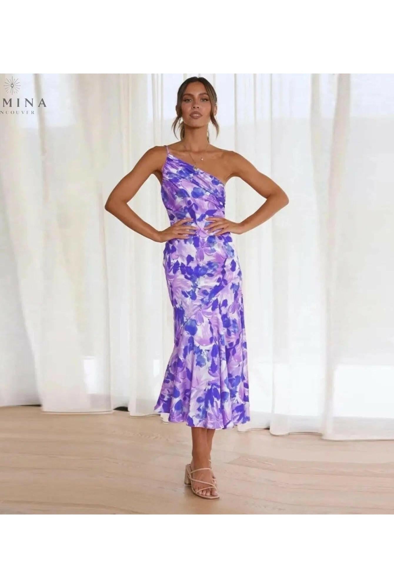 Lumina Wear Tiphaine floral pattern dress in orange, showcasing a stylish and vibrant design perfect for warm weather.