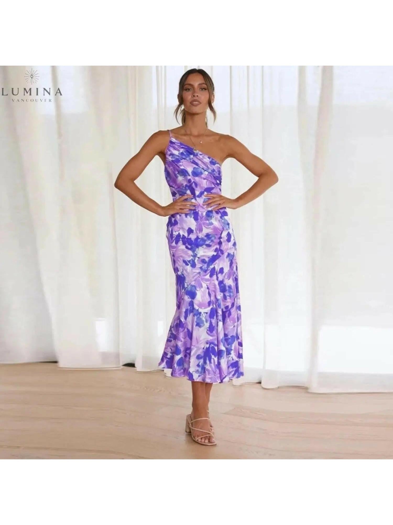 Lumina Vancouver Tiphaine floral patterned dress in orange with a flowing design, perfect for casual or semi-formal occasions.
