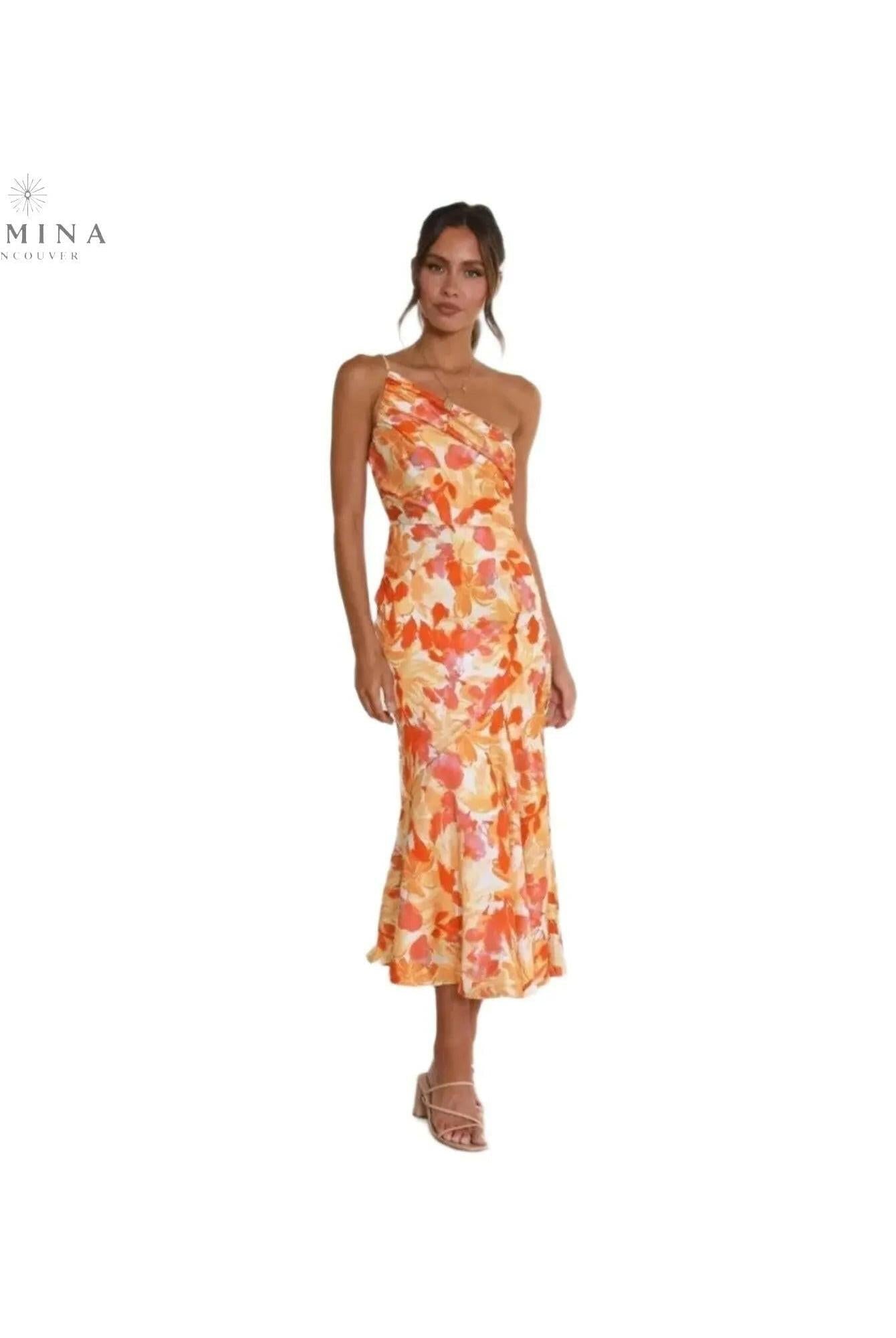 Tiphaine floral patterned orange dress by Lumina Wear, featuring a stylish and vibrant design in a flattering silhouette.