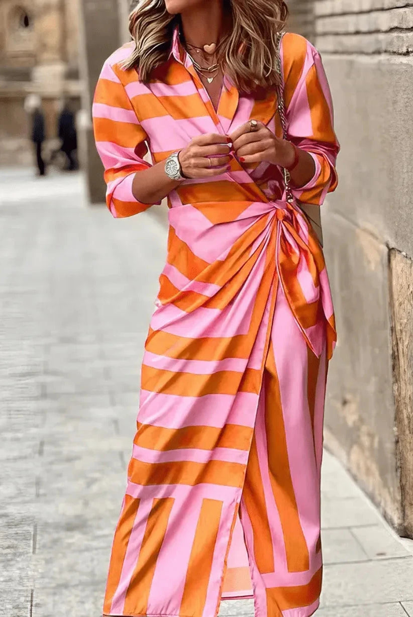 Lumina Wear Solana printed wrap dress in orange and pink floral pattern, stylish and lightweight for warm weather.