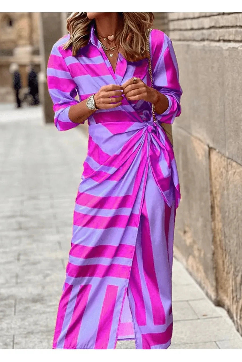 Lumina Wear Solana printed wrap dress in vibrant orange and pink with a stylish design, perfect for casual or dressy occasions.
